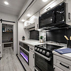 Off-Door Side Slideout Kitchen and 50" Telescoping Television with Fireplace Below